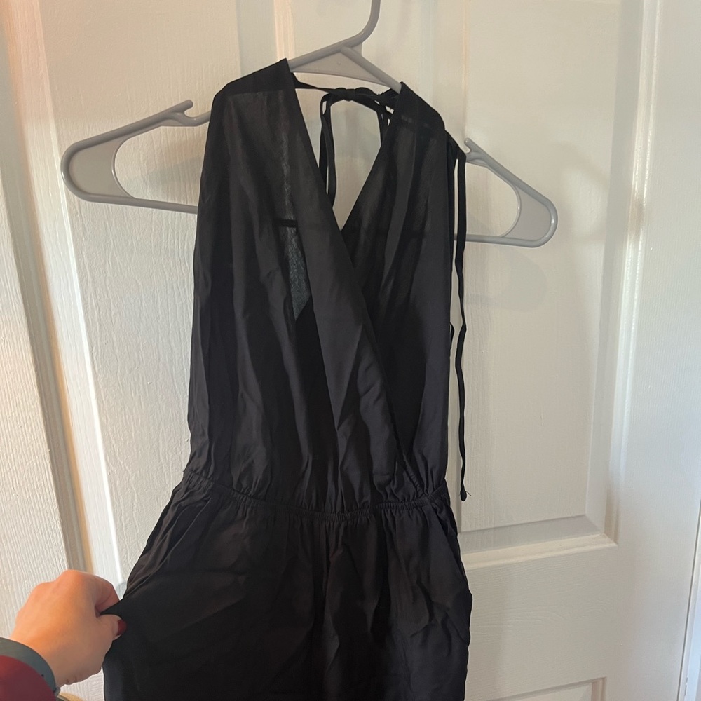 Learning to fly black halter jumpsuit